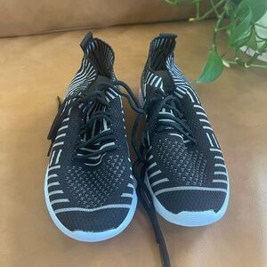 Black and white ‘sock’ style running shoes